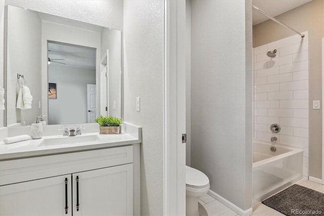 full bath with tub / shower combination, baseboards, toilet, and vanity