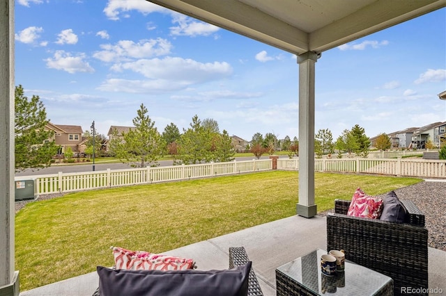 view of patio / terrace with a fenced backyard, a residential view, and an outdoor hangout area