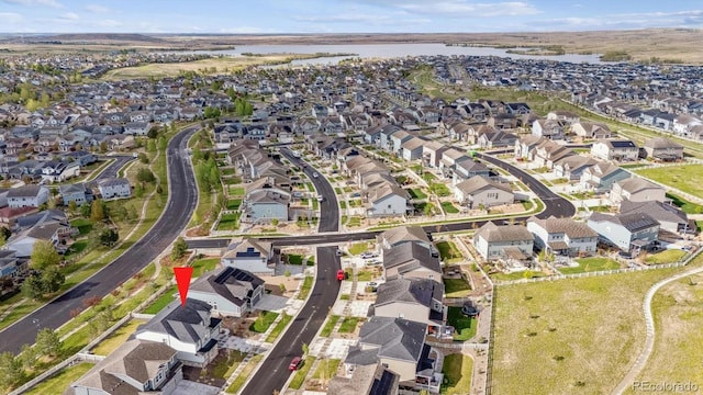 bird's eye view with a residential view and a water view