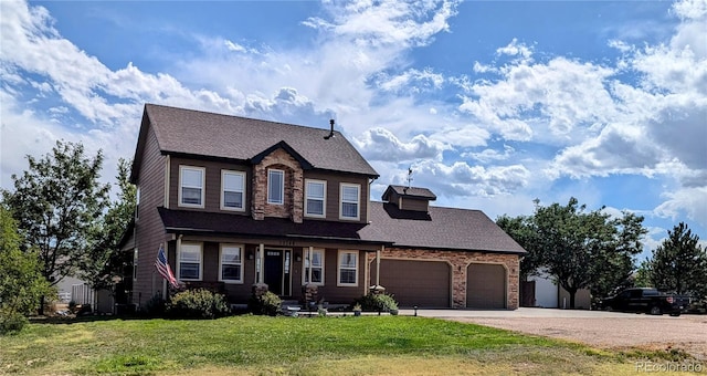 view of front facade with a front lawn and a garage