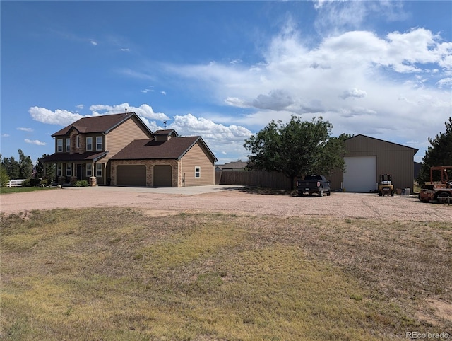 view of side of property with a lawn and a garage