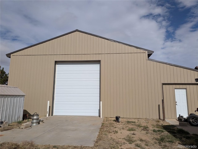 garage with wood walls