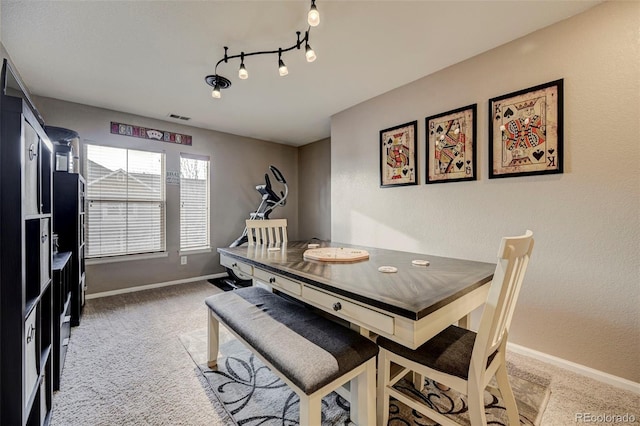 dining space with carpet flooring