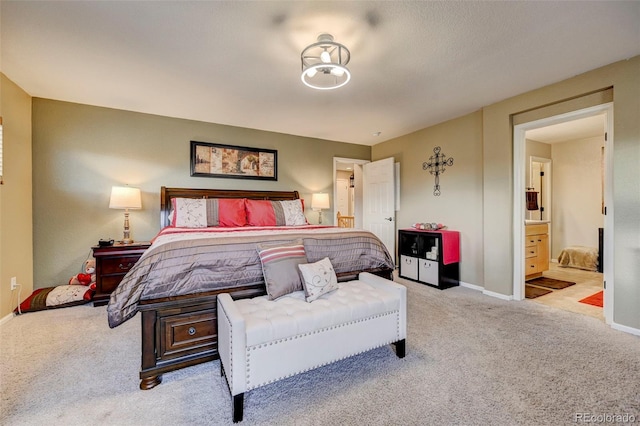 carpeted bedroom with ensuite bathroom