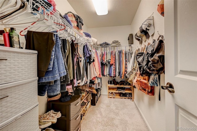 spacious closet with carpet flooring