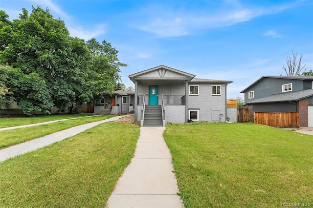 1655 N Yates St, Denver, CO 80204 - view of front of house featuring a porch and brick siding