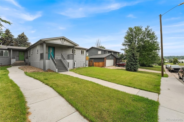 1655 N Yates St, Denver, CO 80204 - view of front of home with an outdoor structure, a front lawn, and brick siding