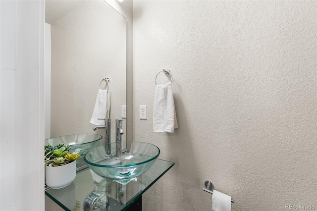 1655 N Yates St, Denver, CO 80204 - bathroom featuring a sink and a textured wall