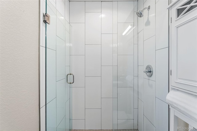 1655 N Yates St, Denver, CO 80204 - bathroom with a shower stall and a textured wall