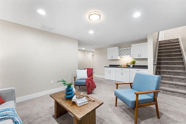 1655 N Yates St, Denver, CO 80204 - living area featuring stairs, light colored carpet, and recessed lighting