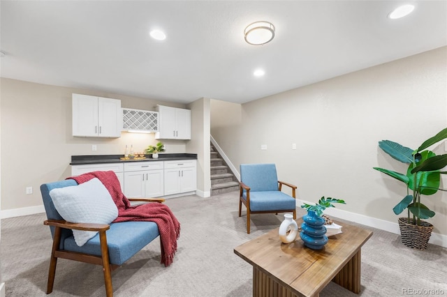1655 N Yates St, Denver, CO 80204 - living room with bar with sink, light colored carpet, stairs, and recessed lighting