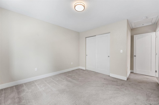 1655 N Yates St, Denver, CO 80204 - unfurnished bedroom featuring carpet, attic access, and a closet