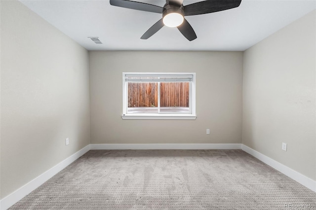 1655 N Yates St, Denver, CO 80204 - carpeted spare room with baseboards and ceiling fan