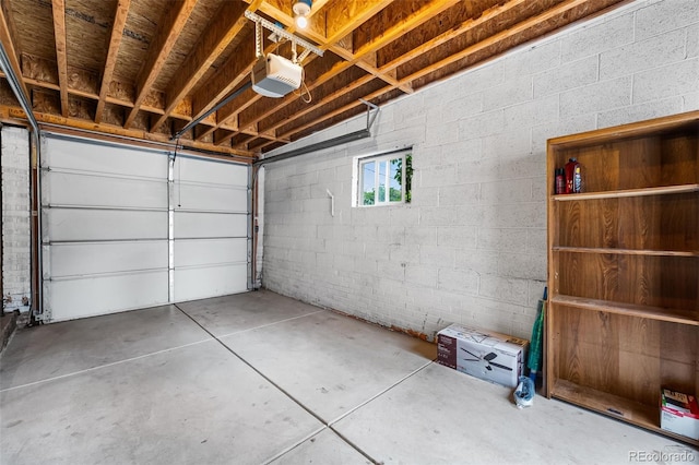 1655 N Yates St, Denver, CO 80204 - garage with a garage door opener and concrete block wall