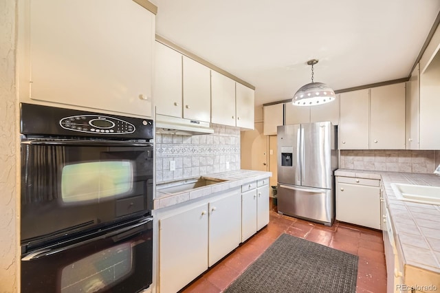 6710 W Nevada Pl, Lakewood, CO 80226 - kitchen with black appliances, tile countertops, decorative backsplash, white cabinetry, and under cabinet range hood