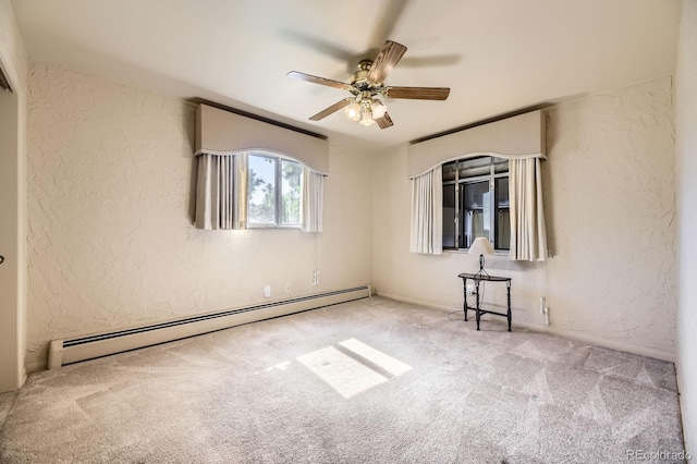 6710 W Nevada Pl, Lakewood, CO 80226 - unfurnished room featuring a baseboard heating unit, a textured wall, carpet, and ceiling fan