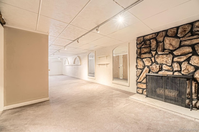 6710 W Nevada Pl, Lakewood, CO 80226 - unfurnished living room featuring carpet flooring, rail lighting, and a fireplace