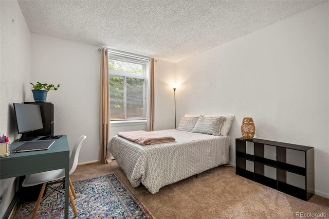 carpeted bedroom with a textured ceiling