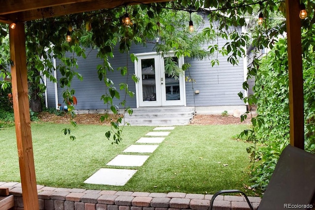 view of yard with french doors