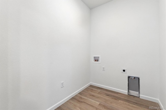 18951 E 96th Pl, Commerce City, CO 80022 - laundry area featuring electric dryer hookup, hookup for a washing machine, and light wood finished floors