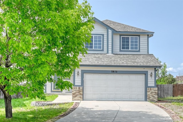 5831 Moon Ridge Dr, Colorado Springs, CO 80922 - view of front facade featuring concrete driveway, brick siding, an attached garage, and roof with shingles
