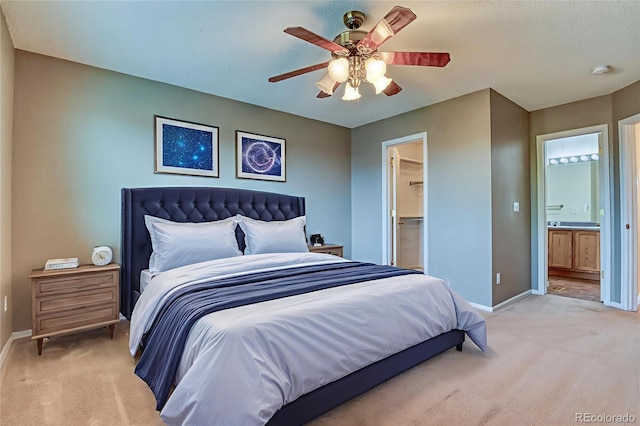 5831 Moon Ridge Dr, Colorado Springs, CO 80922 - bedroom with light carpet, baseboards, a walk in closet, a ceiling fan, and a closet