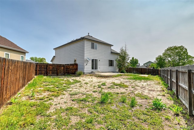 5831 Moon Ridge Dr, Colorado Springs, CO 80922 - back of house with a fenced backyard and a patio