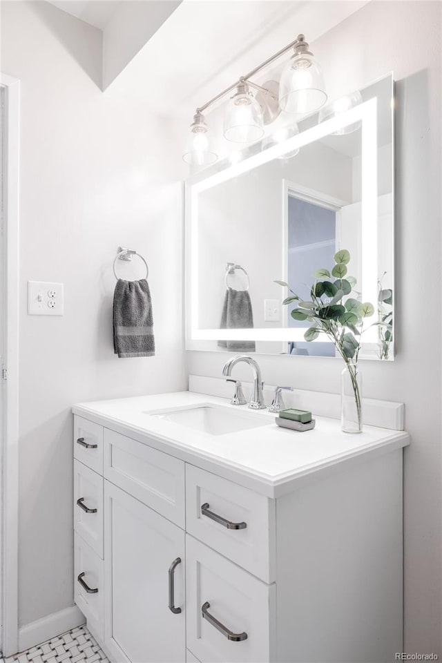 bathroom with tile patterned flooring and vanity