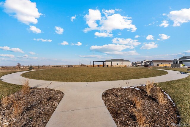 surrounding community featuring a residential view and a yard