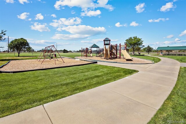 community play area featuring a lawn