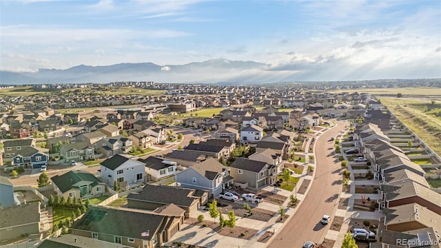 8895 Vanderwood Rd, Colorado Springs, CO 80908 - aerial view of property's location with nearby suburban area and a mountain backdrop