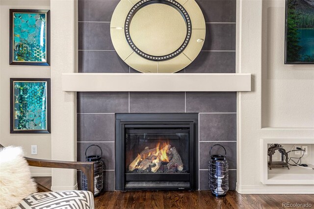 8895 Vanderwood Rd, Colorado Springs, CO 80908 - detailed view of wood finished floors and a fireplace