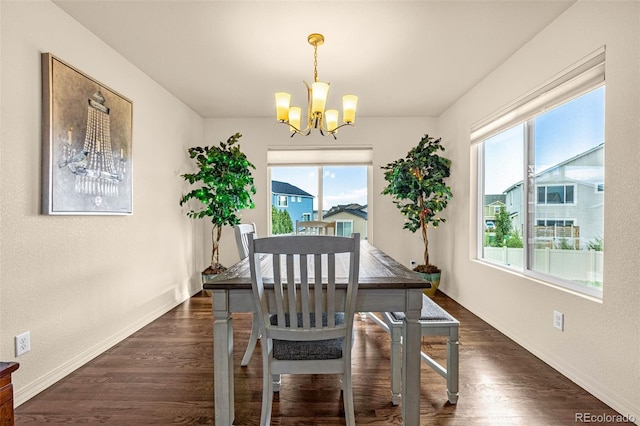 8895 Vanderwood Rd, Colorado Springs, CO 80908 - dining area featuring a chandelier, plenty of natural light, and dark wood-style floors