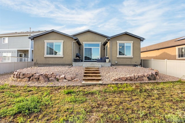 8895 Vanderwood Rd, Colorado Springs, CO 80908 - rear view of property with stucco siding