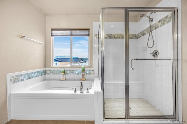 8895 Vanderwood Rd, Colorado Springs, CO 80908 - bathroom with a bath, a shower stall, and tile patterned floors