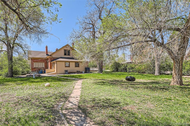view of yard with a patio and a fire pit