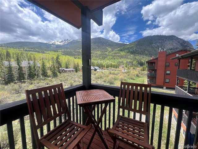 570 Bills Ranch Rd Unit 335, Frisco, CO 80443 - wooden terrace featuring a mountain view and a wooded view