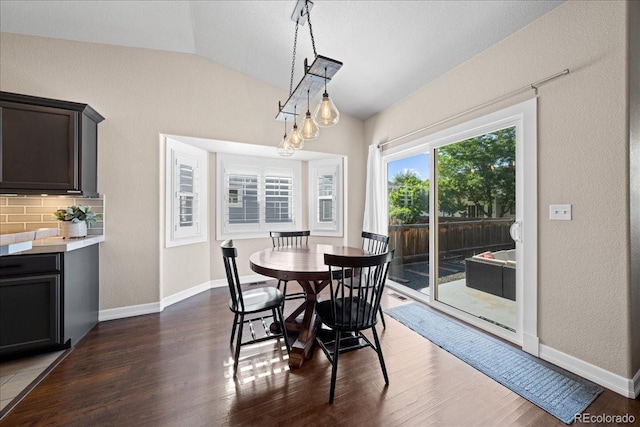 115 Quandary Ave, Berthoud, CO 80513 - dining area with lofted ceiling, dark wood-style floors, and a textured wall