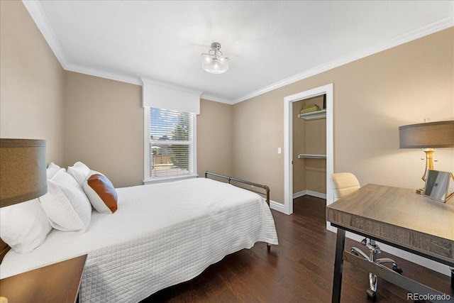 115 Quandary Ave, Berthoud, CO 80513 - bedroom with wood finished floors, ornamental molding, and a walk in closet