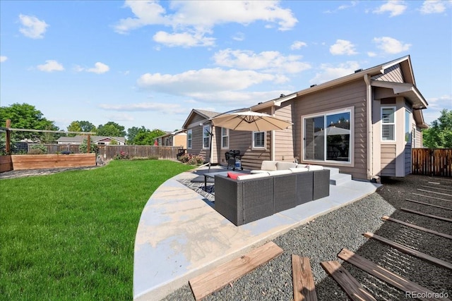 115 Quandary Ave, Berthoud, CO 80513 - back of house featuring a fenced backyard, an outdoor hangout area, and a patio area