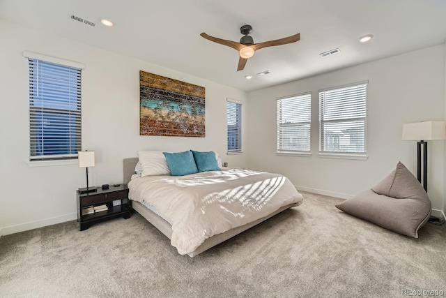 bedroom with carpet floors, baseboards, and visible vents