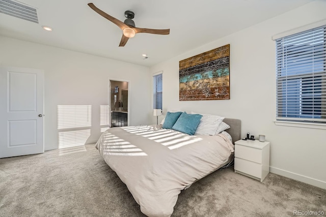 carpeted bedroom featuring recessed lighting, a ceiling fan, visible vents, baseboards, and ensuite bath