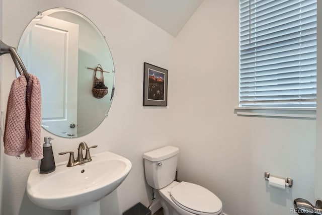 half bath with a sink and toilet