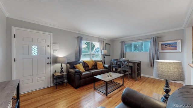 living area with light wood finished floors and crown molding