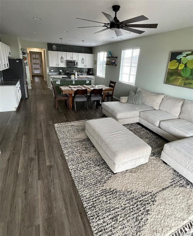 3974 Castle Vista Ln, Castle Rock, CO 80104 - living room featuring ceiling fan and dark wood-style flooring