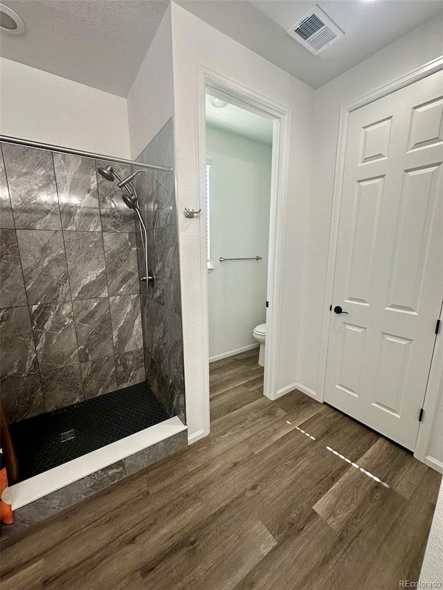 3974 Castle Vista Ln, Castle Rock, CO 80104 - full bathroom with a stall shower and wood finished floors