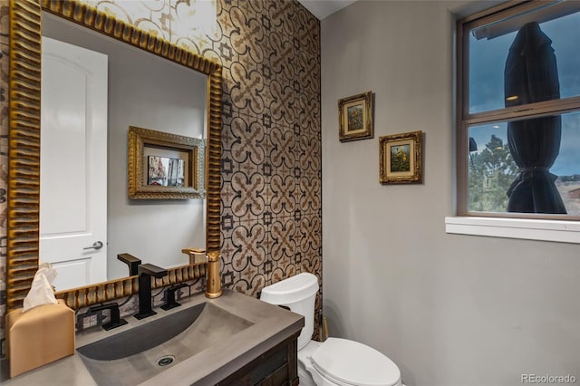 bathroom with vanity and toilet