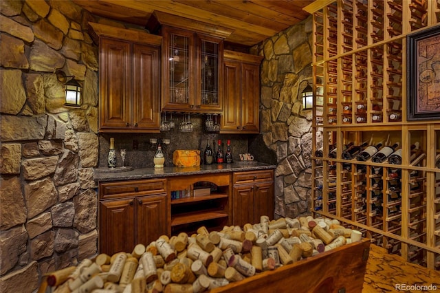 wine area with wood ceiling