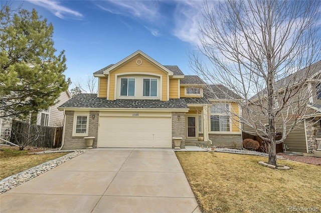 view of property with a front yard and a garage