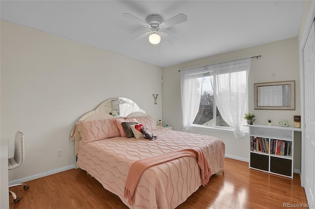 bedroom with ceiling fan and wood-type flooring